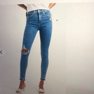 Express high waisted ripped raw hem skinny jeans